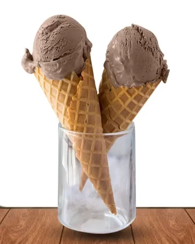 2 crossed ice cream cone with a scoop of Mocha ice cream each, placed in a glass on a brown platform.